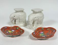 A pair of blanc de chine Chinese elephant stands with octagonal tops on moulded bases, (h16cm x 11cm