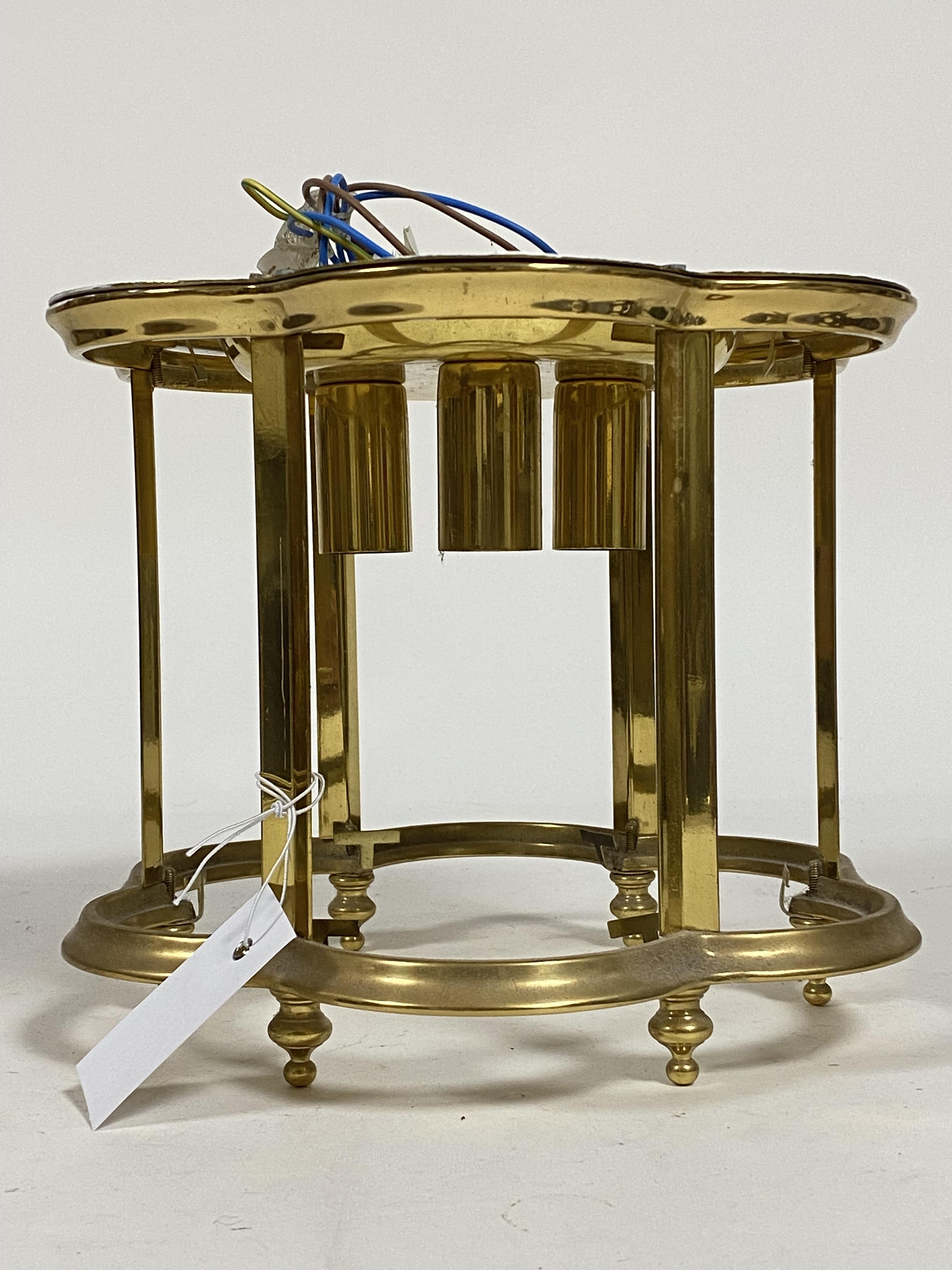 A lacquered brass three branch hall lantern of scalloped form, no glass H22cm