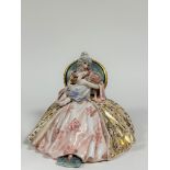 A Capodimonte style porcelain figure of a seated lady holding a child. (marked verso) ( h-27cm w-