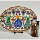 A Greek Skyros scalloped dish decorated with Middle Eastern style dancing figures, decorated with