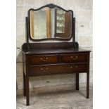 An early 20th century mahogany dressing chest, the swing mirror over two short and one long
