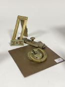 A collection of brass door furniture, to include a late 19th century brass door knocker and back