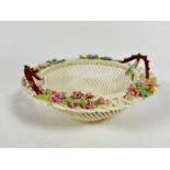 A Belleek Irish porcelain twin handled basket with open woven border, with floral painted