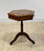 A hardwood tripod table, the hexagonal top fitted with two drawers raised on turned column and