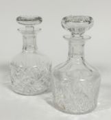 Two crystal slice cut and thumb cut port decanters with faceted slice cut stoppers, (h23cm and 22cm)