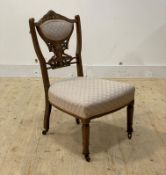 An Edwardian inlaid rosewood upholstered bedroom chair, moving on castors, H79cm