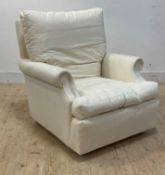 A traditional armchair, covered in under ticking ready for upholstery, with down filled squab