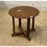 A 1930's oak circular lamp table on cruciform base, H43cm, D51cm