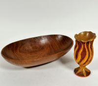 A teak mid century oval salad bowl, (h 9cm x 39cm x 24cm) and a Donnachi treen carved elm vase