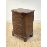 A Georgian style cross banded mahogany bow front chest, fitted with four drawers flanked by fluted