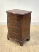 A Georgian style cross banded mahogany bow front chest, fitted with four drawers flanked by fluted