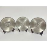 A set of three Chinese zodiac pewter plates dated 1981, 1986 and 1988, The Year of the Pig, The Year