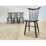 A set of four vintage stained ash plywood and turned beech dining chairs, with comb back and