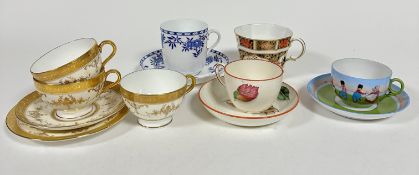 A Wedgwood creamware cup and saucer, decorated with handpainted enamel leaf sprays with ochre