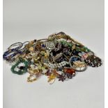 A large collection of costume jewellery including bead necklace, paste pearl necklace, moonstone