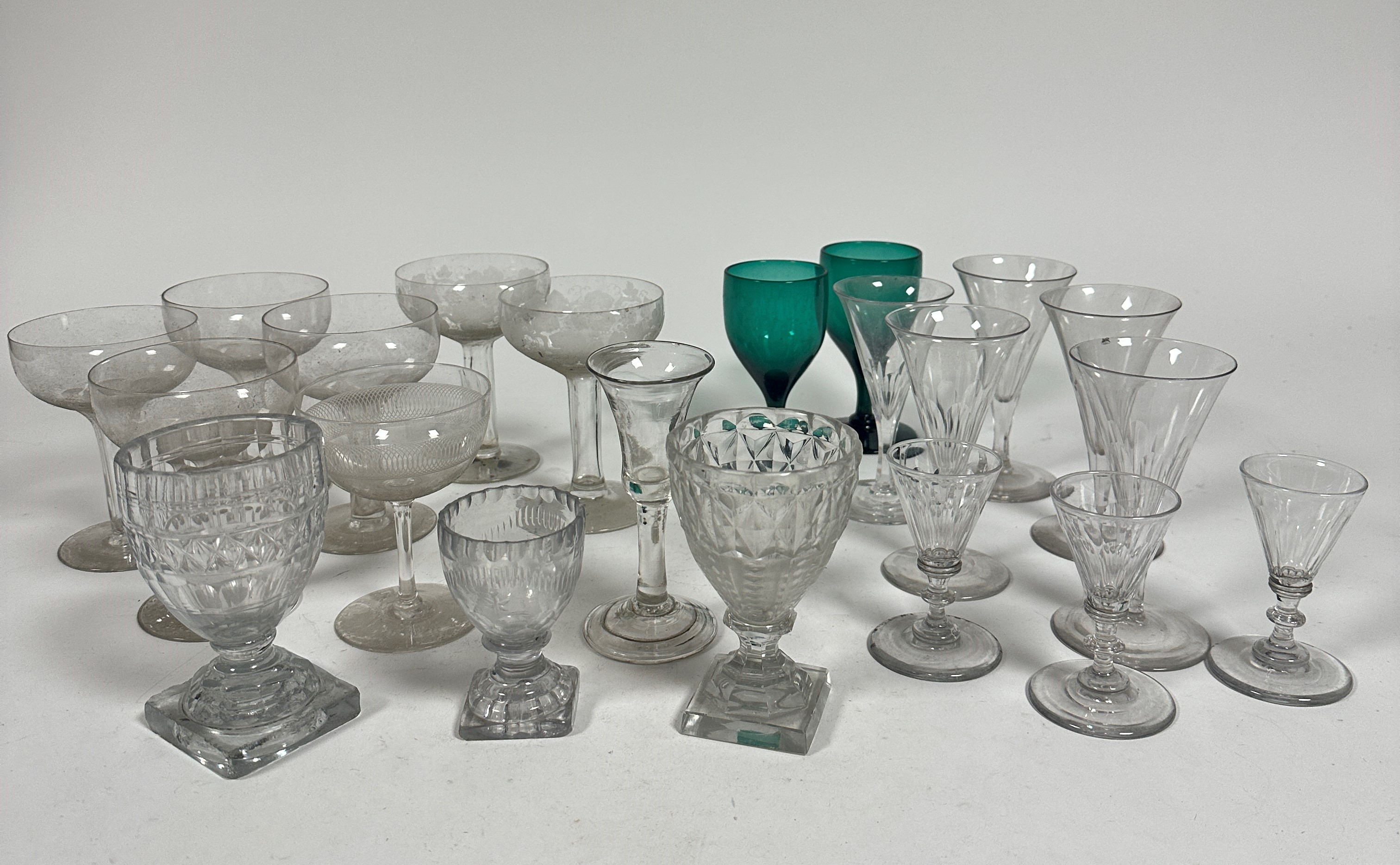 A set of four crystal hollow stem Champagne bowls, (h 12.5cm x 9cm) two similar with etched vine