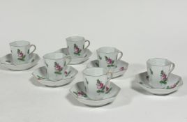 A set of six Hungarian Herend pottery octagonal chocolate cups and saucers decorated with pink