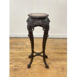 A late Qing dynasty rosewood jardiniere or vase stand, the octagonal top with beaded edge inset with