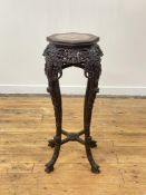A late Qing dynasty rosewood jardiniere or vase stand, the octagonal top with beaded edge inset with