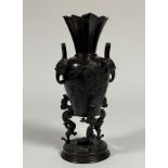 A Japanese bronze tripod censer, Meiji period, of baluster form, the body in relief with baskets