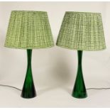 A pair of green resin table lamps, of waisted form, by Pooky Lighting, with green printed cotton