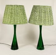 A pair of green resin table lamps, of waisted form, by Pooky Lighting, with green printed cotton