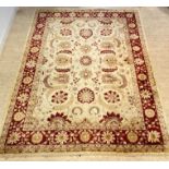 A large Ziegler type rug, hand knotted, the ivory field decorated with interlaced foliate and