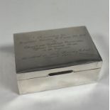 A silver cigarette box, Walker & Hall, Sheffield 1965, of plain oblong form, the cover with