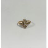 A late Victorian three stone diamond and seed pearl ring, the three graduated round old brilliant-