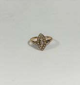 A late Victorian three stone diamond and seed pearl ring, the three graduated round old brilliant-