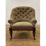 An early Victorian walnut-framed spoon back armchair, the buttoned back above a stuffed-over seat,