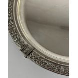 A George V Scottish silver tray, Brook & Son, Edinburgh 1931, circular, the rim in relief with a