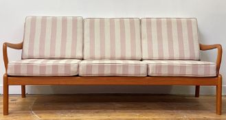 L Olsen & Son, A Danish mid century teak three seat sofa, the slatted back over sprung squab