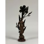 A French spelter figural lamp in the Art Nouveau taste, signed Moreau, modelled as a lady nestled