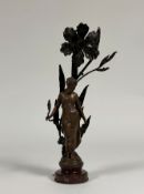 A French spelter figural lamp in the Art Nouveau taste, signed Moreau, modelled as a lady nestled