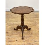 An early Victorian rosewood tripod table, the scalloped top with raised edge over a baluster