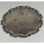 A George V silver tea tray, Alexander Clark & Co., Birmingham 1931, in the Georgian taste, circular,