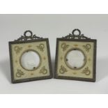 A pair of Edwardian gilt-metal photograph frames, each square frame with ribbon-tied wreath