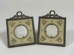 A pair of Edwardian gilt-metal photograph frames, each square frame with ribbon-tied wreath