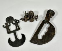 A group of bronze objects of Pre Columbian inspiration comprising: a small crescent-form blade