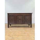 A late 18th/ early 19th century oak three panel coffer, the top opening to a plain interior fitted