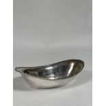 A George V silver bread basket, R. & W. Sorley, Glasgow 1931, oval, with reeded rim. Length 31cm, c.