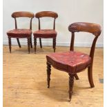 A set of three Victorian mahogany side chairs, circa 1840, the crest rail carved with scrolling