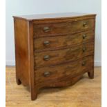 A Hepplewhite period mahogany chest of drawers of serpentine outline, the frieze inlaid with