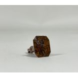 A 19th century agate desk seal, engraved with a bell and a monogram, of faceted tapering form,