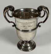 Military interest: a George V twin-handled silver trophy cup, Walker & Hall, Sheffield, 1914, with