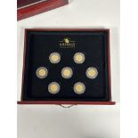 A cased set of seven George V full sovereigns: 1912, 1914 (2), 1918 (2), 1925 and 1930, each in a