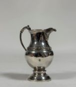 A George V silver cream jug, Davidson, Henderson & Sorley, Birmingham 1914, of baluster form, with