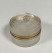 Lalique: a "Daphne" glass powder box, with moulded hinged cover and gilt-metal mounts, etched