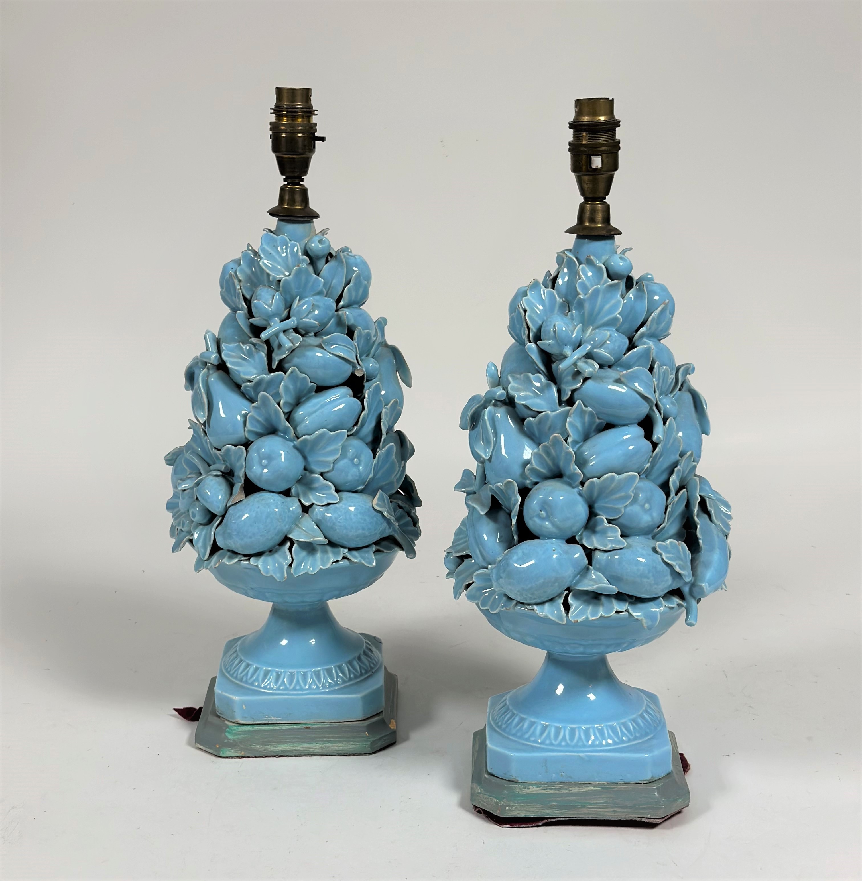 A pair of vintage Casa Pupo pottery table lamps, each modelled as a bowl of fruit, in a powder